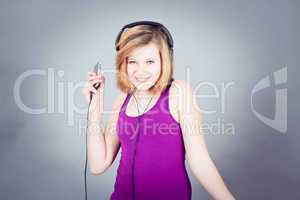 dancing happy teenager girl listening to music