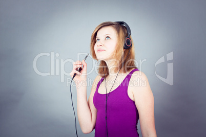 dancing happy teenager girl listening to music