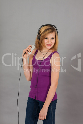 dancing happy teenager girl listening to music