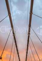Wires and structure of suspension bridge at dusk