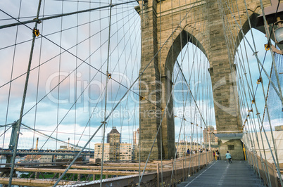 Magnificent structure of Brooklyn Bridge with sunset sky - NYC