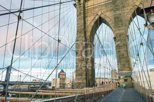 Magnificent structure of Brooklyn Bridge with sunset sky - NYC