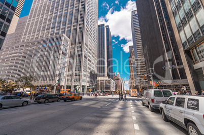 NEW YORK CITY - JUNE 12, 2013: Locals and tourists walk along ci