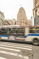 NEW YORK CITY - JUNE 13, 2013: Public us crosses city street. Pu