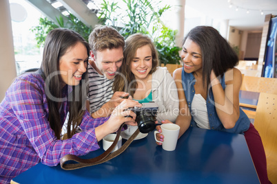 Young students looking at a camera