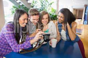 Young students looking at a camera