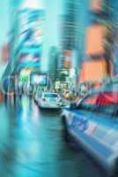 Blurred picture of New York police car in Times Square at night