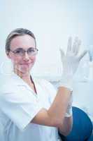 Female dentist wearing surgical glove