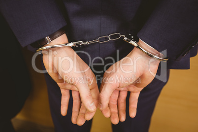 Hands of businessman with handcuffs