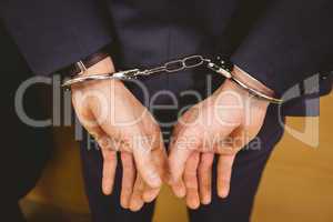 Hands of businessman with handcuffs