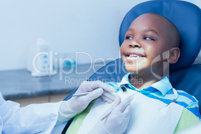 Close up of boy having his teeth examined