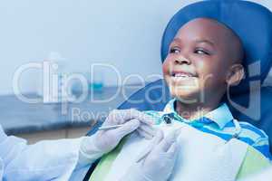 Close up of boy having his teeth examined