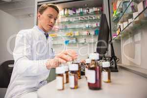 Pharmacist using computer at desk