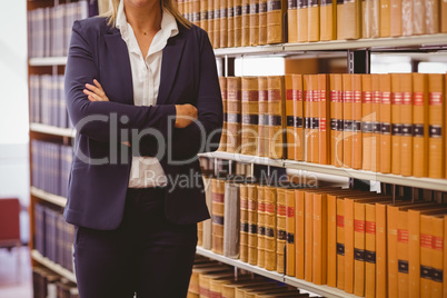 Mature female librarian posing with crossed arms