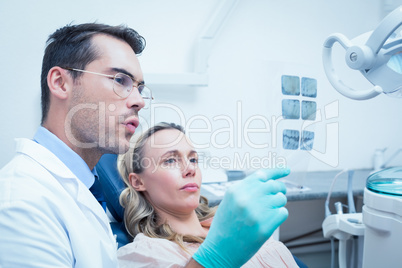 Dentist showing woman her mouth x-ray