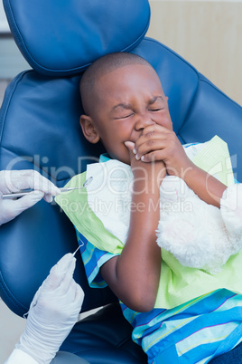 Close up of boy having his teeth examined