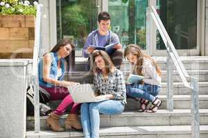 Students sitting on steps studying