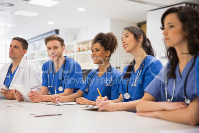 Medical student smiling at the camera during class