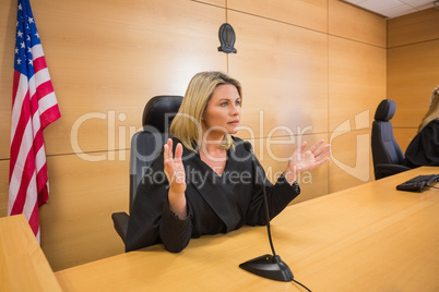 Stern judge speaking to the court