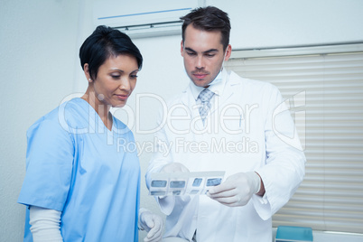 Dentists looking at x-ray