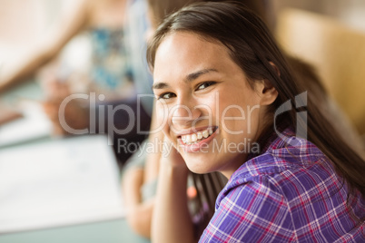 Portrait of a smiling student revising