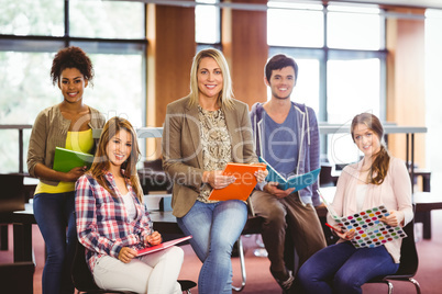 Smiling students working together on an assignment