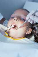 Close up of girl having her teeth examined