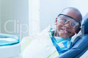 Smiling boy waiting for dental exam