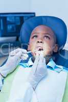 Close up of boy having his teeth examined