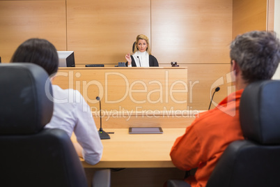 Lawyer and client listening to judge