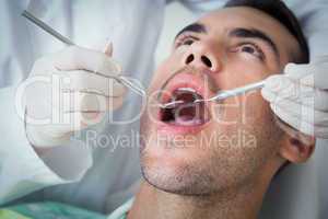 Close up of man having his teeth examined