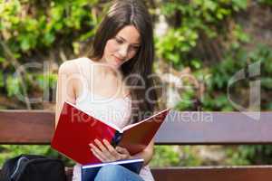 Pretty student studying outside on campus