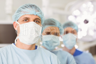 Team of surgeons looking at camera