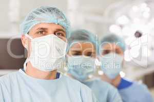 Team of surgeons looking at camera