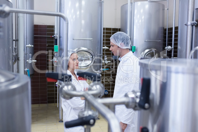 Biologist team talking and wearing hairnet