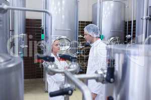 Biologist team talking and wearing hairnet