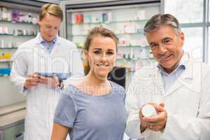Happy customer talking with pharmacist