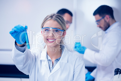 Science student holding up test tube