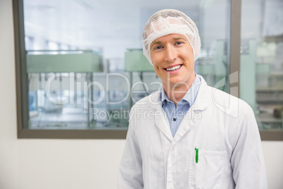 Happy pharmacist in a hairnet