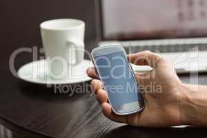 Student holding his mobile phone