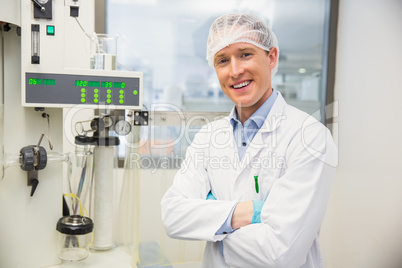 Pharmacist using machinery to make medicine