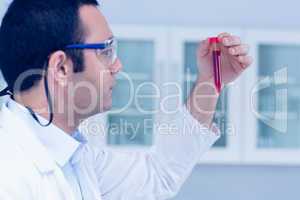 Science student holding up vial