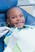 Close up of boy having his teeth examined