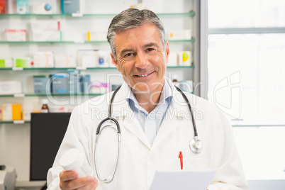 Happy pharmacist smiling at camera