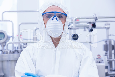 Portrait of a scientist standing with arms crossed