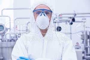 Portrait of a scientist standing with arms crossed