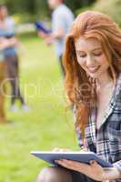 Pretty student studying outside on campus