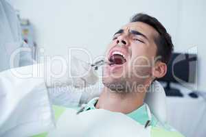 Close up of man having his teeth examined