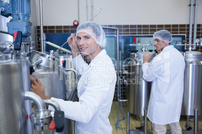 Scientist working and smiling at camera