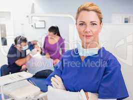 Dentist with folded arms